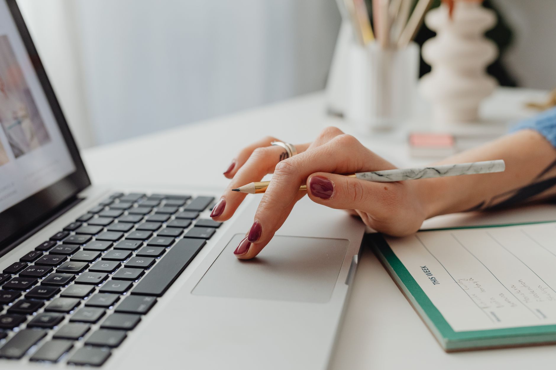 Freelancer organizing tasks for multiple clients on a laptop using Foco
