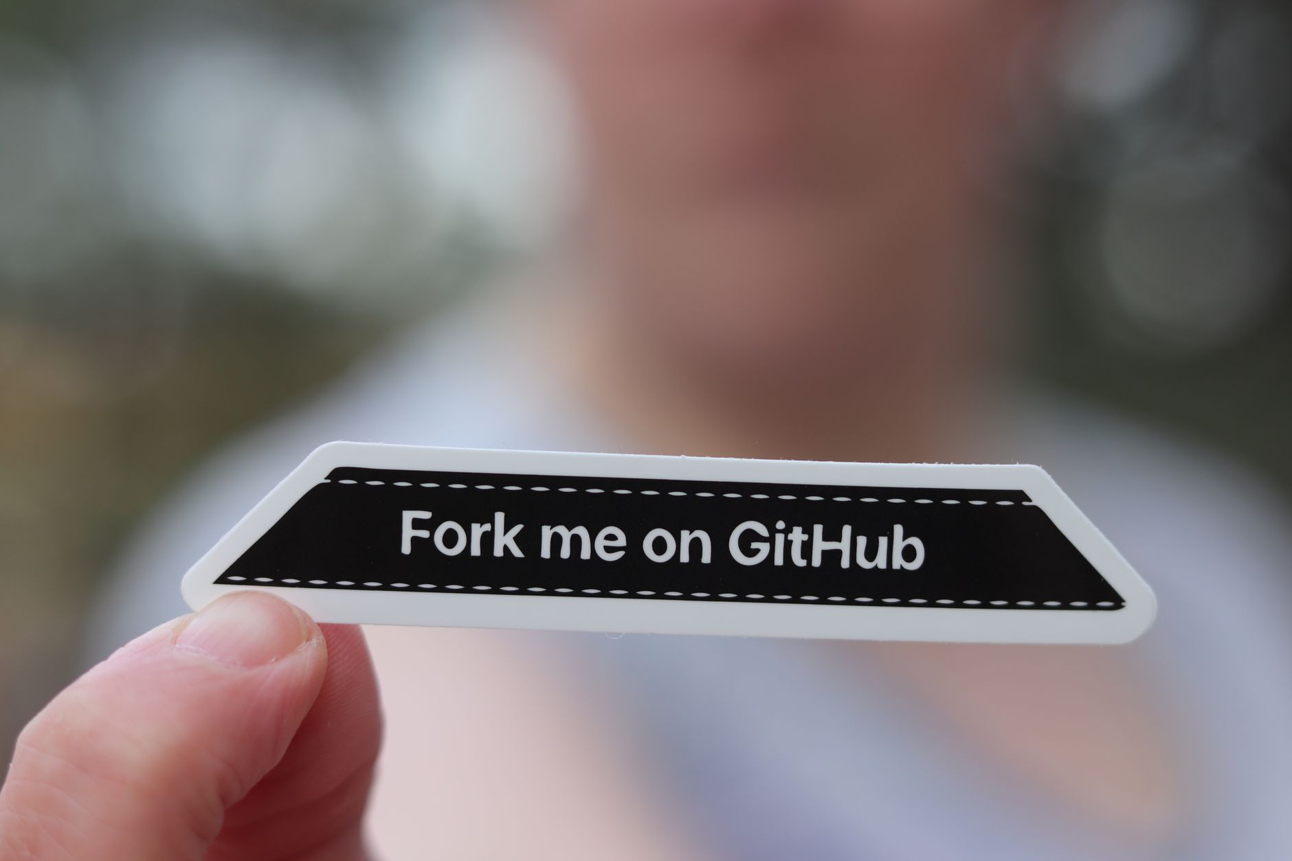 Developer coding with GitHub issues open on screen