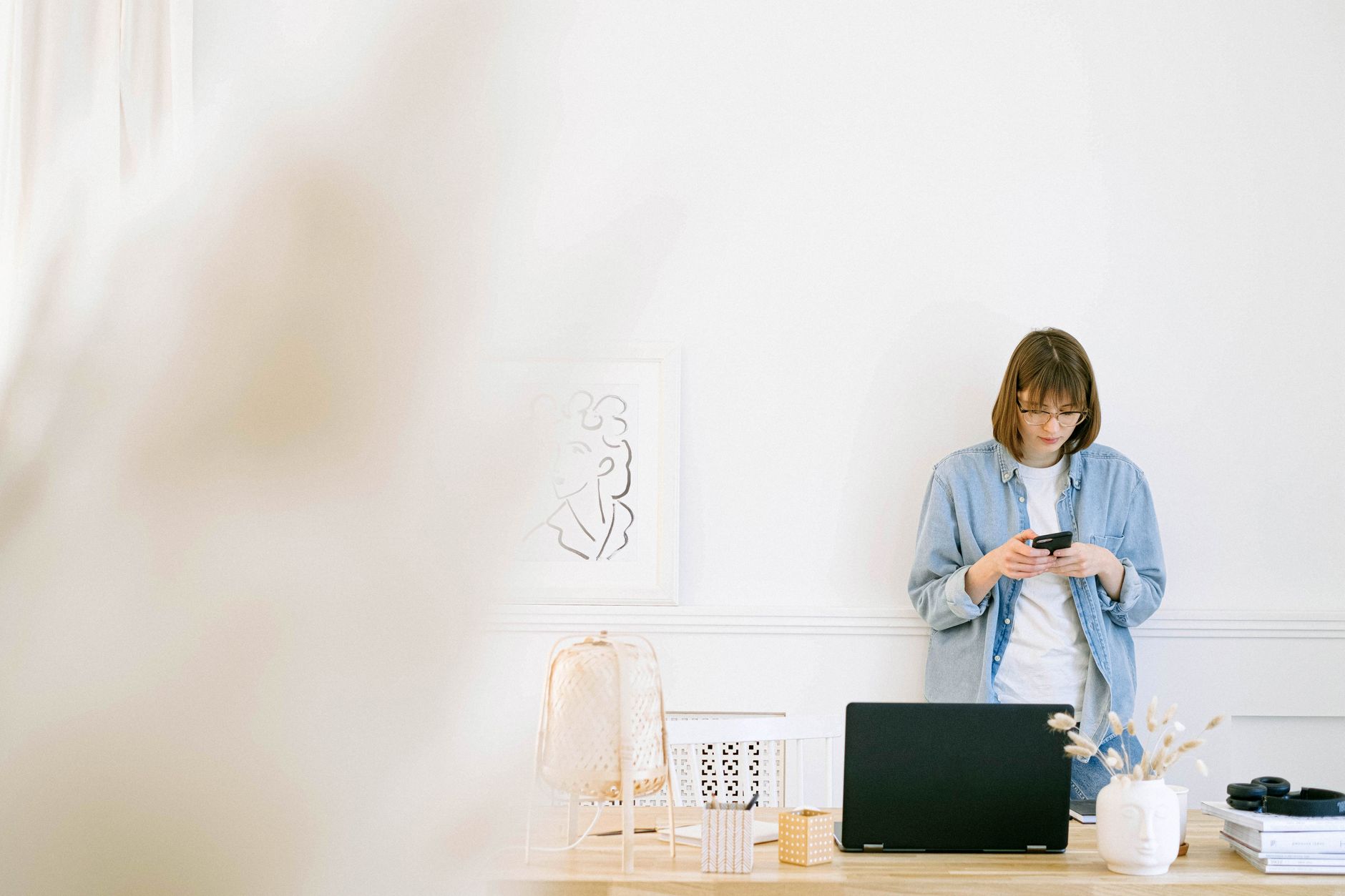 Freelancer checking emails on laptop to convert requests into tasks
