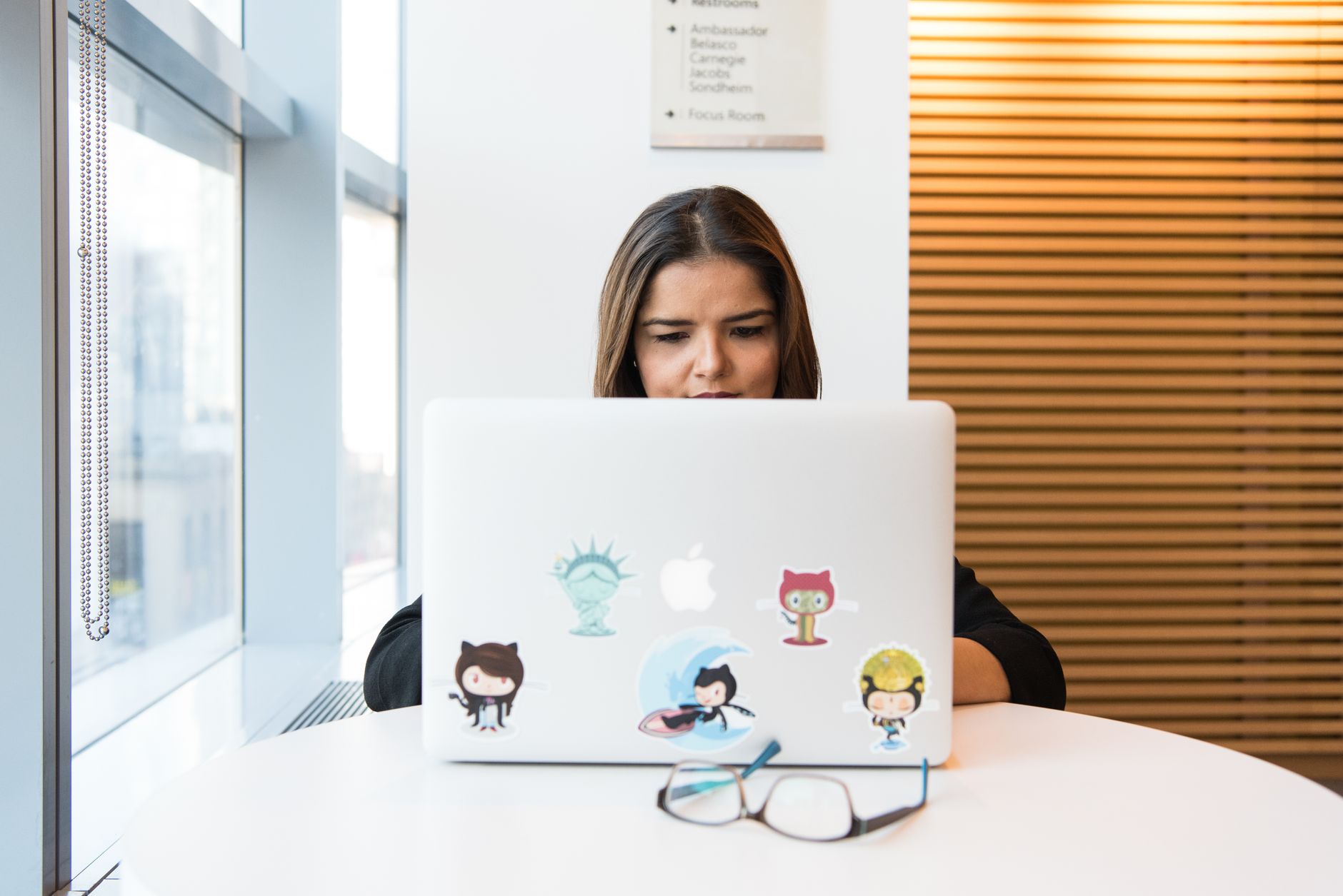 Developer reviewing GitHub issues on a laptop with Foco