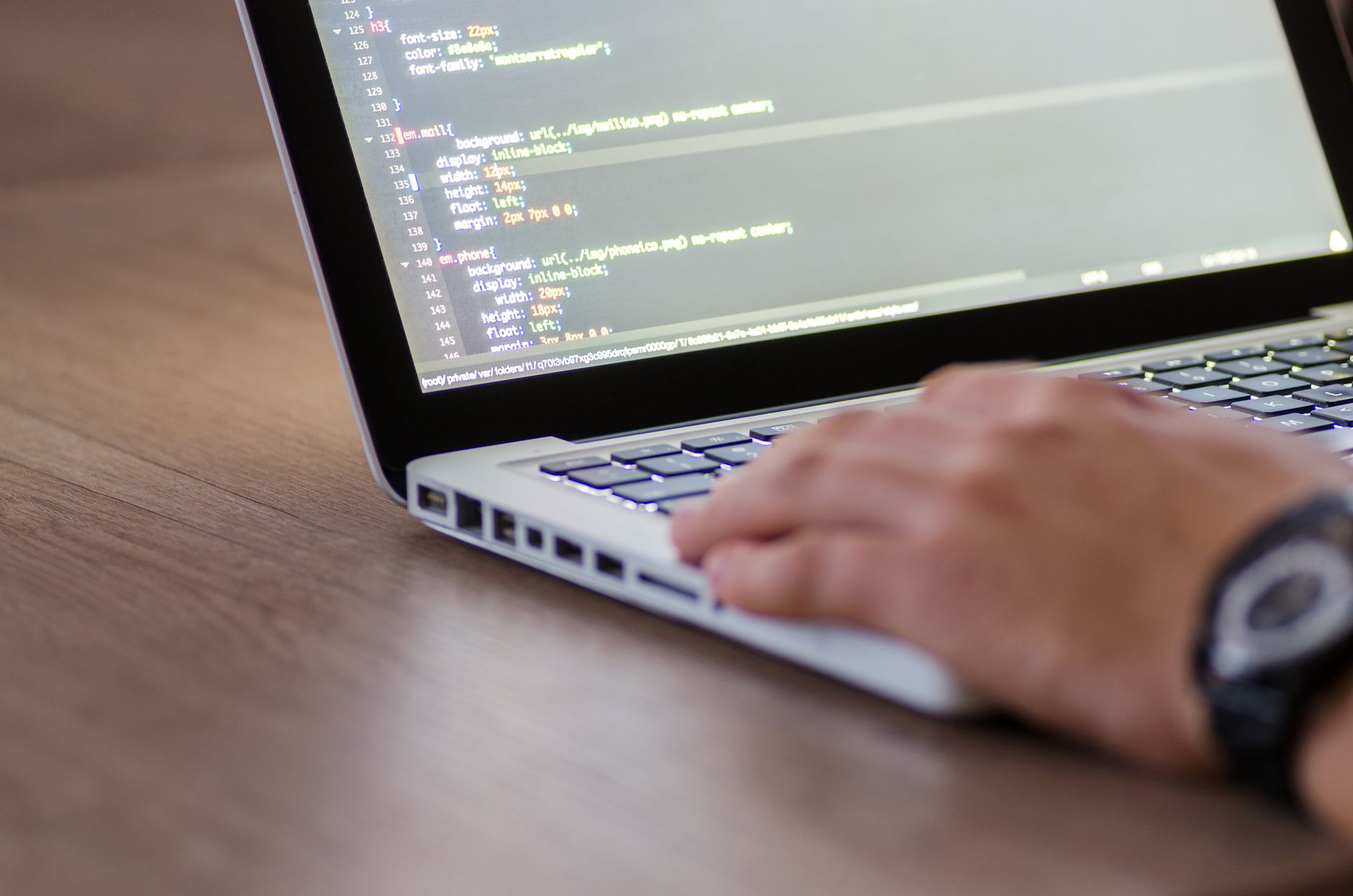 Developer reviewing GitHub issues on a laptop with Foco app open