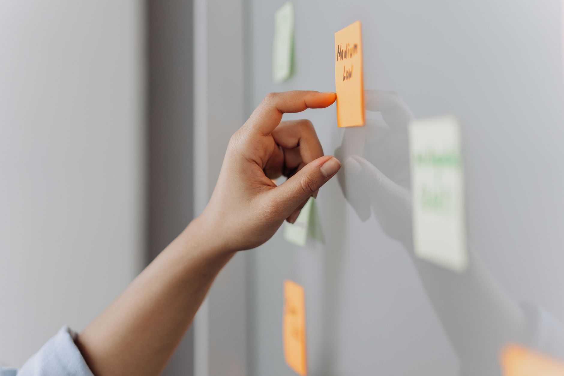 Freelancer organizing tasks on a Kanban board with color-coded works