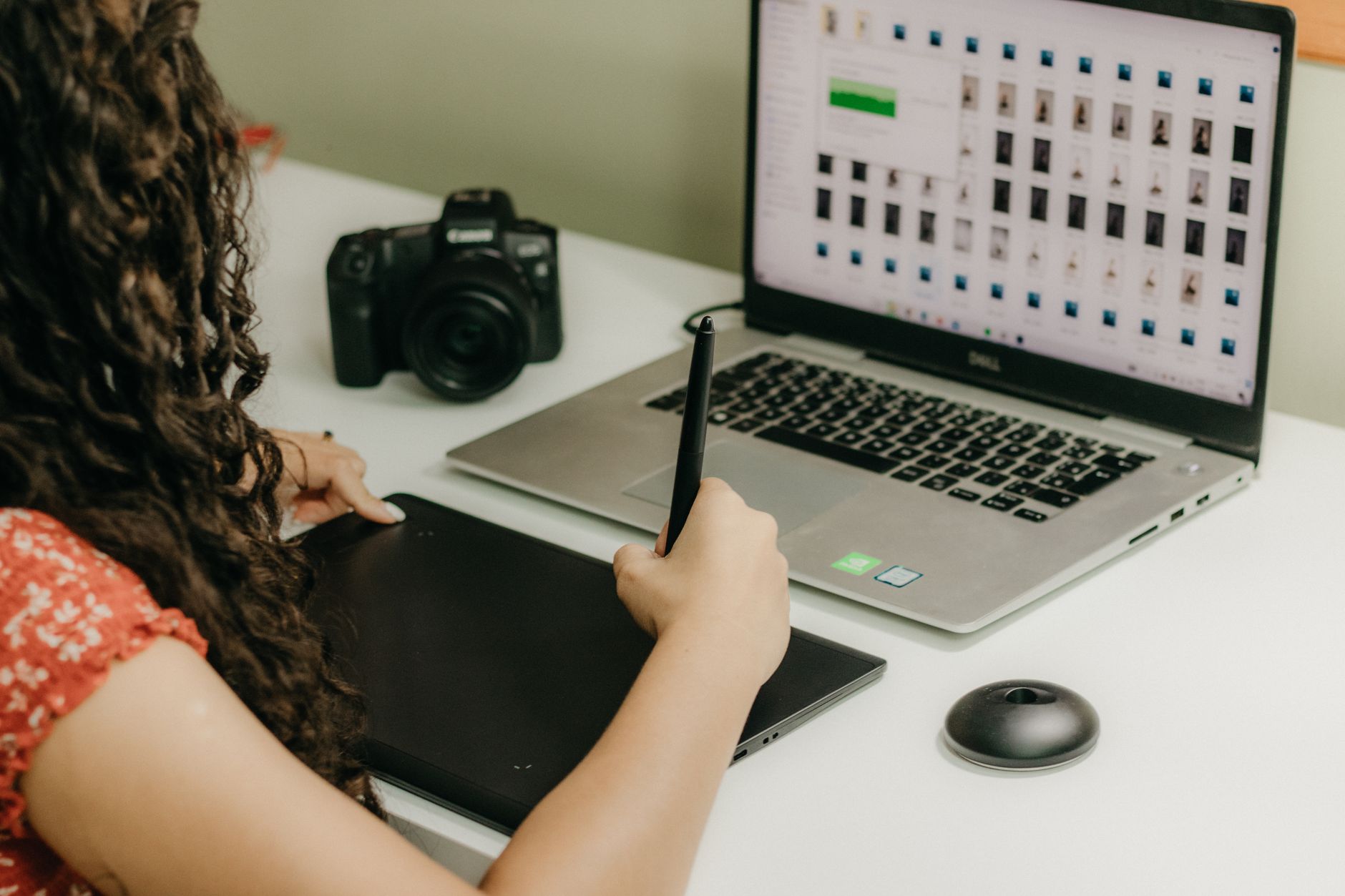 Designer reviewing wireframes on tablet with time blocks