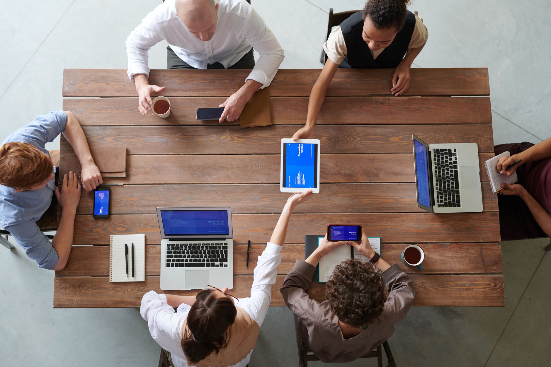 Team syncing work tools during a meeting