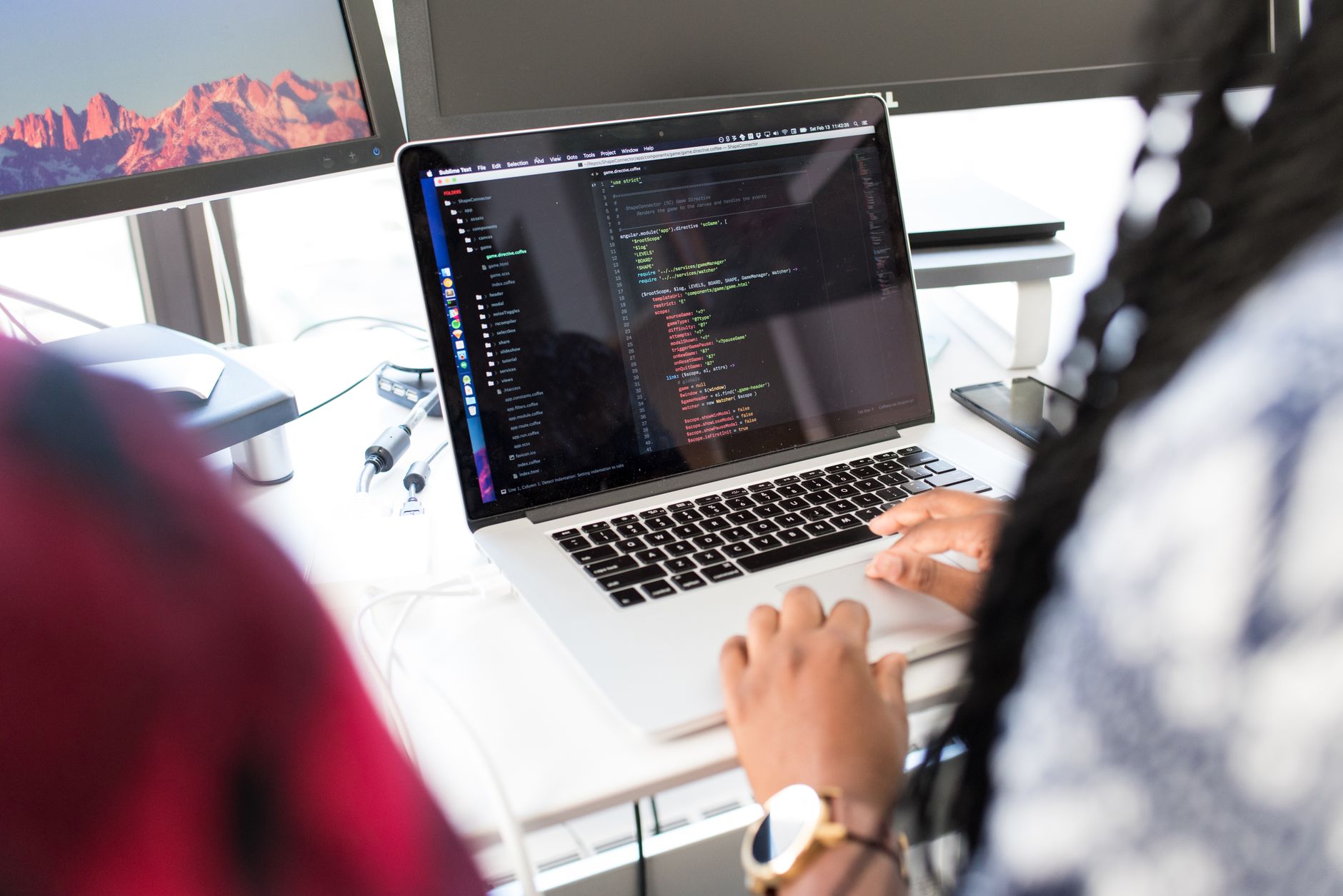 Developer reviewing GitHub issues on a laptop with Foco.