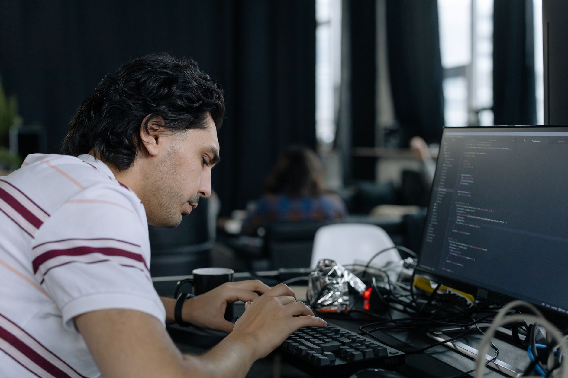 Developer focused on a coding batch in a distraction-free workspace