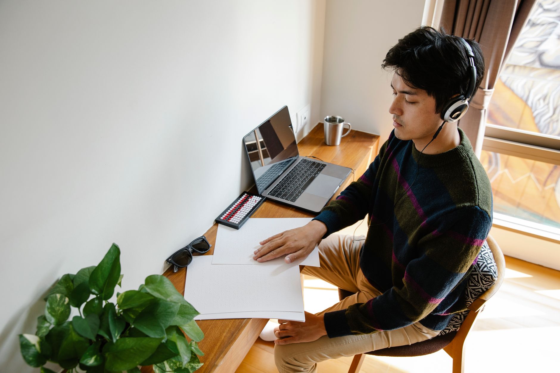 Person focused on three key tasks in a home office