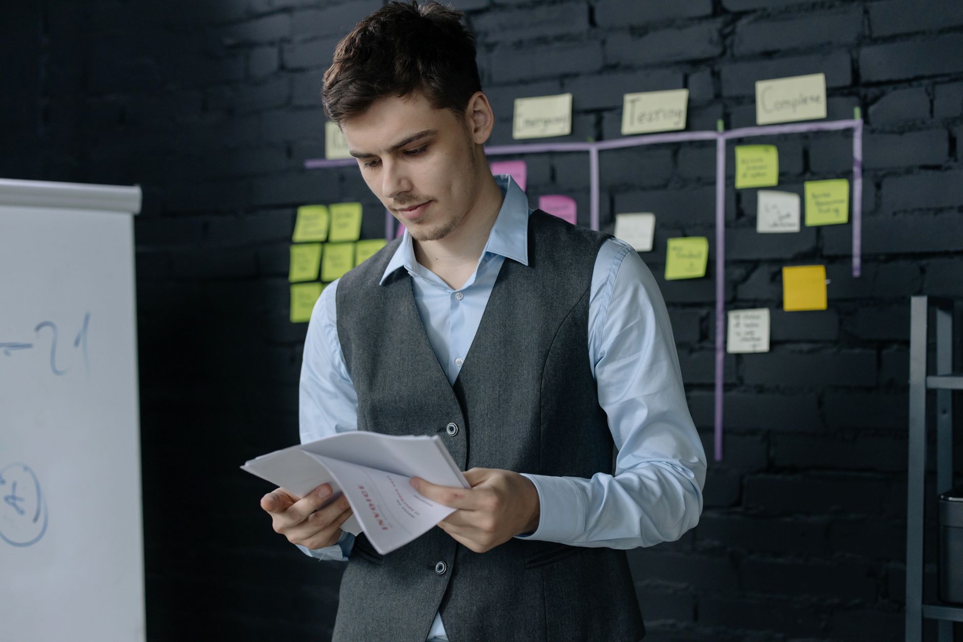 Developer reviewing tasks on a mobile app with tags and priorities