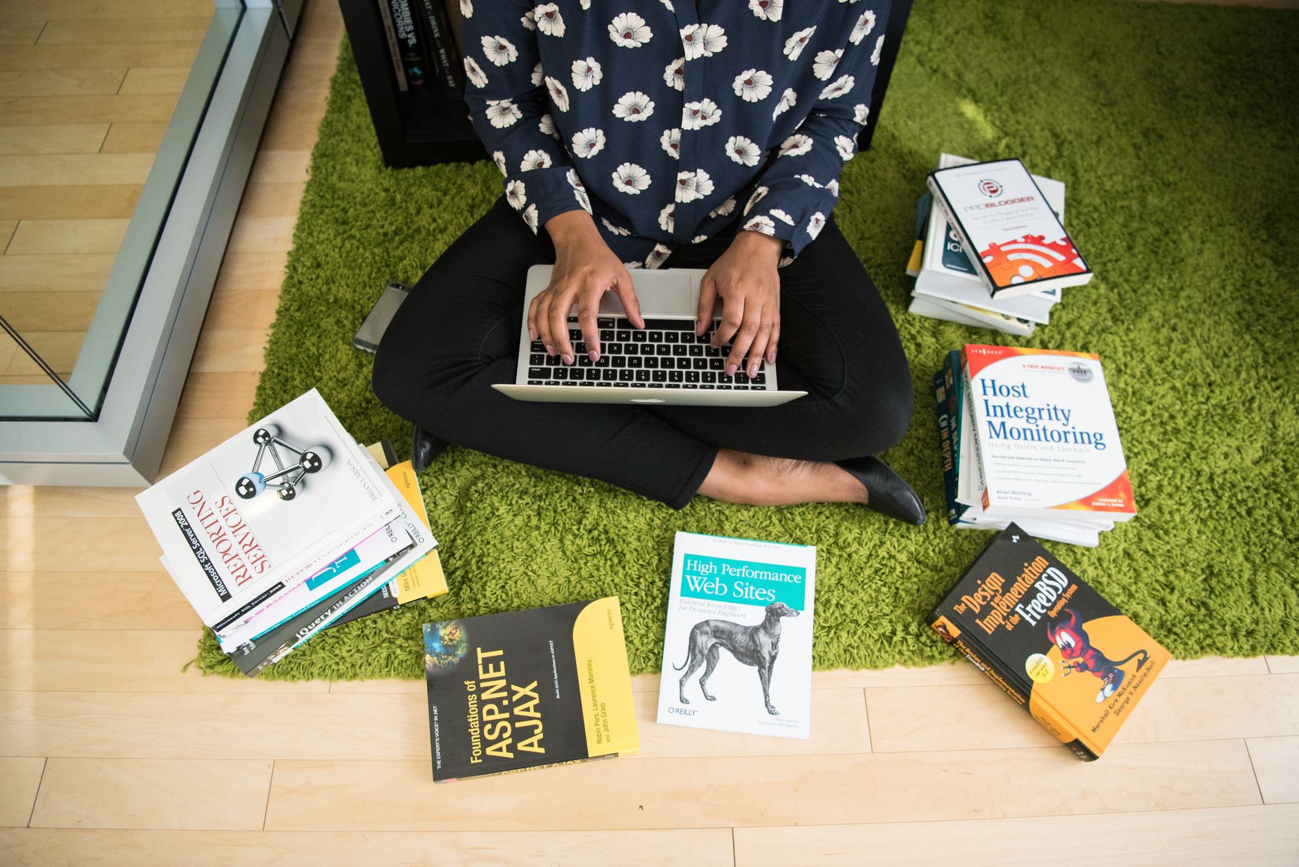 Developer reviewing GitHub issues and Jira tasks on a laptop